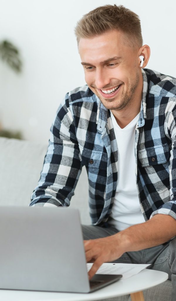 guy-listening-to-music-online-in-headphones.jpg